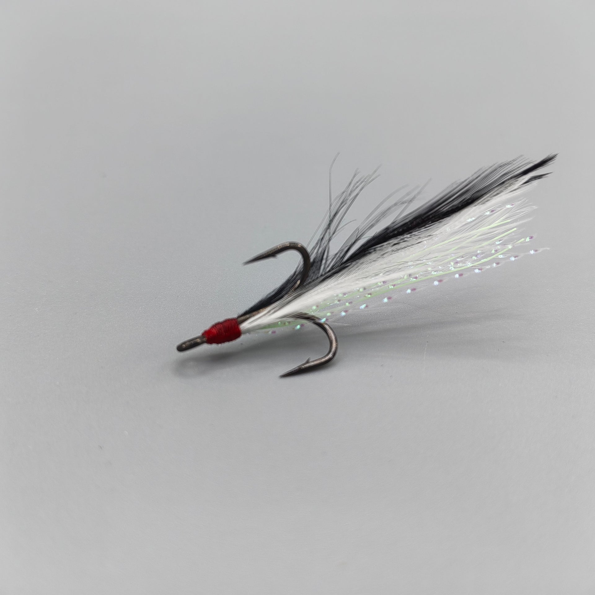 bottom fishing feathered vietnamese hooks RF6- 8 (size 6) with white feather & fish skin our custom #4 treble hooks with unique feathers will give you the edge you need to land that trophy catch VMC Dressed X-Rap Treble Hook